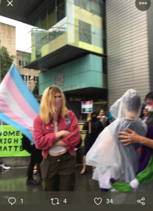 Tall counter protester in facemask