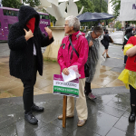 Women's rights protester interacting with trans activist counter-protester